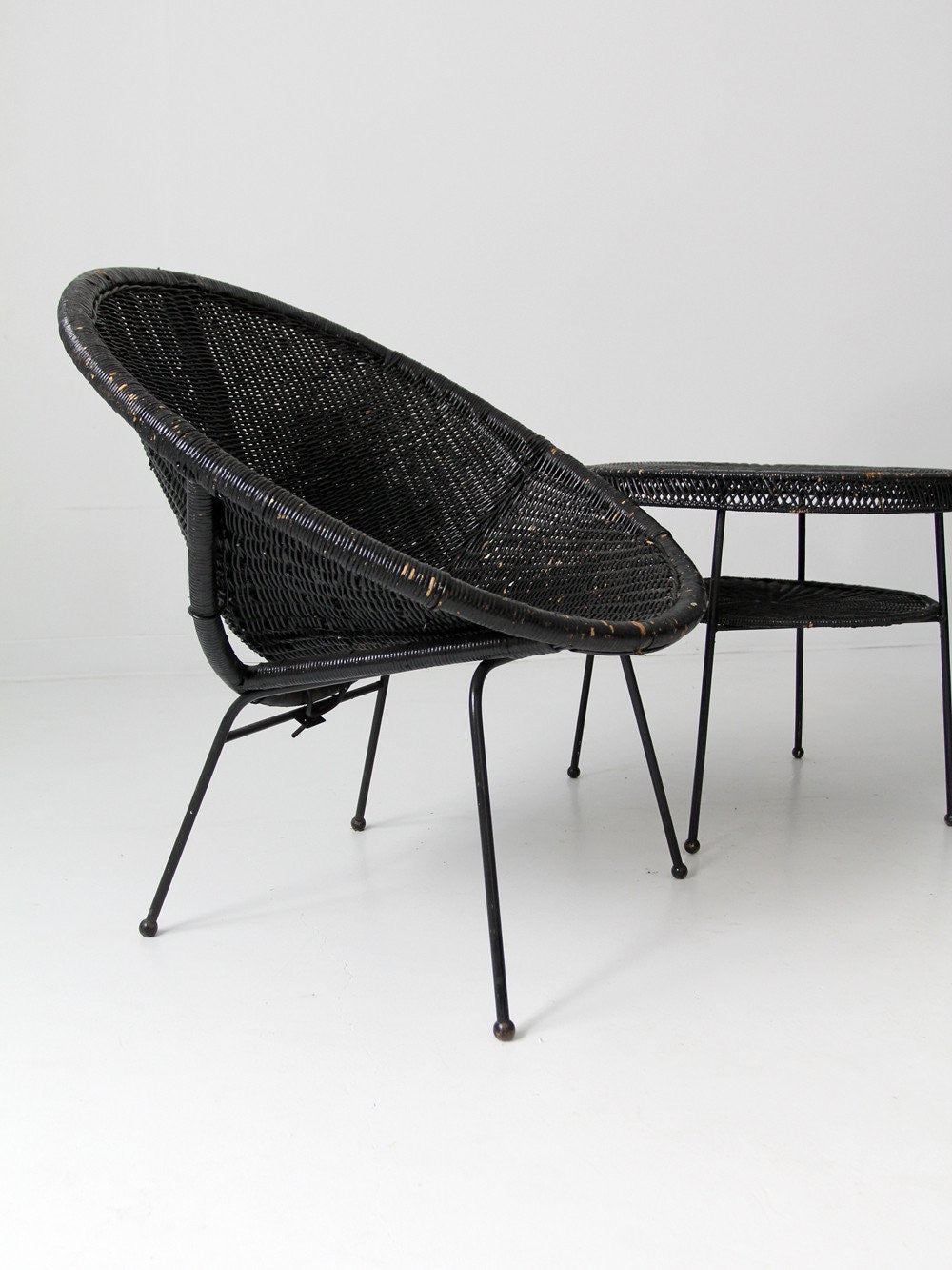 mid century black wicker saucer chair