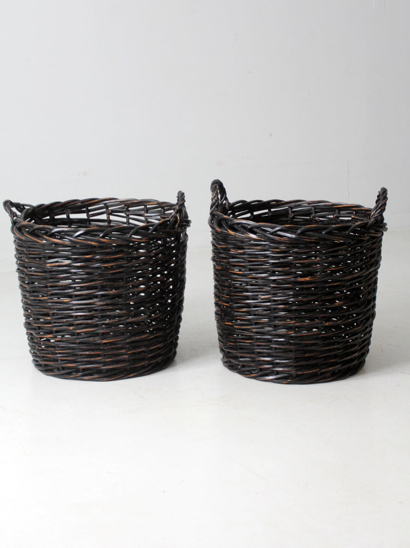 vintage black woven cane baskets pair