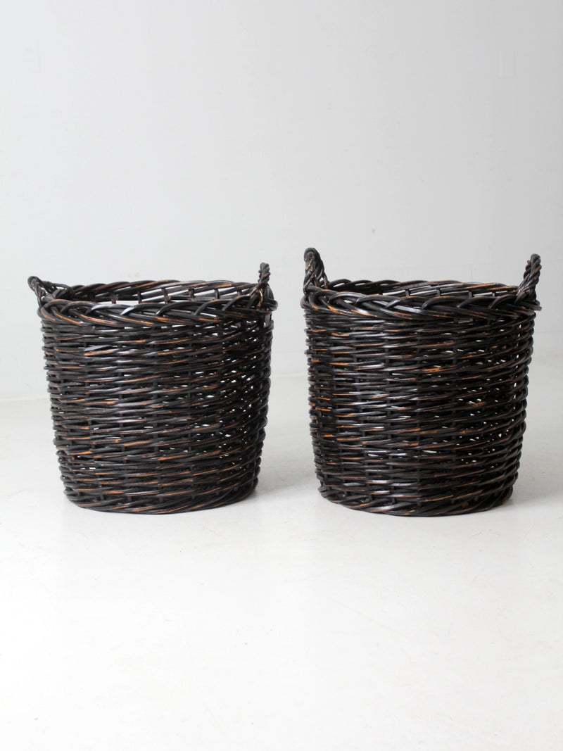 vintage black woven cane baskets pair