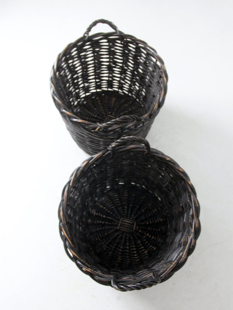 vintage black woven cane baskets pair