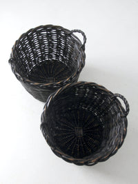 vintage black woven cane baskets pair