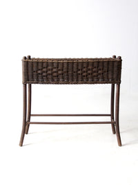 antique woven wicker planter stand