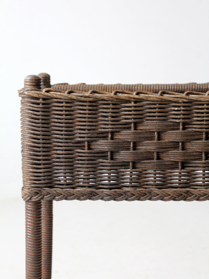 antique woven wicker planter stand