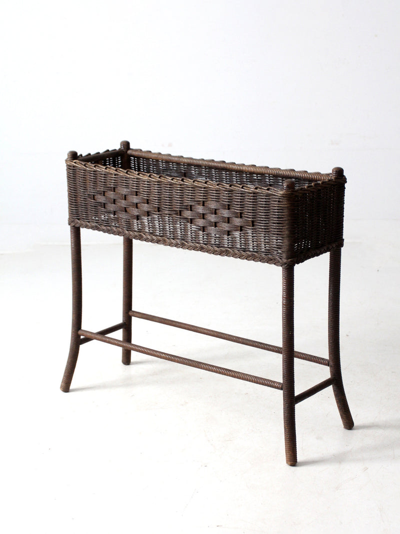 antique woven wicker planter stand