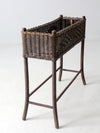 antique woven wicker planter stand