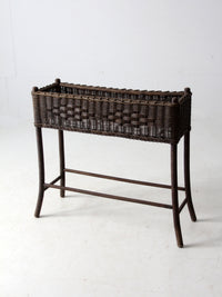 antique woven wicker planter stand