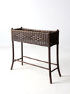 antique woven wicker planter stand