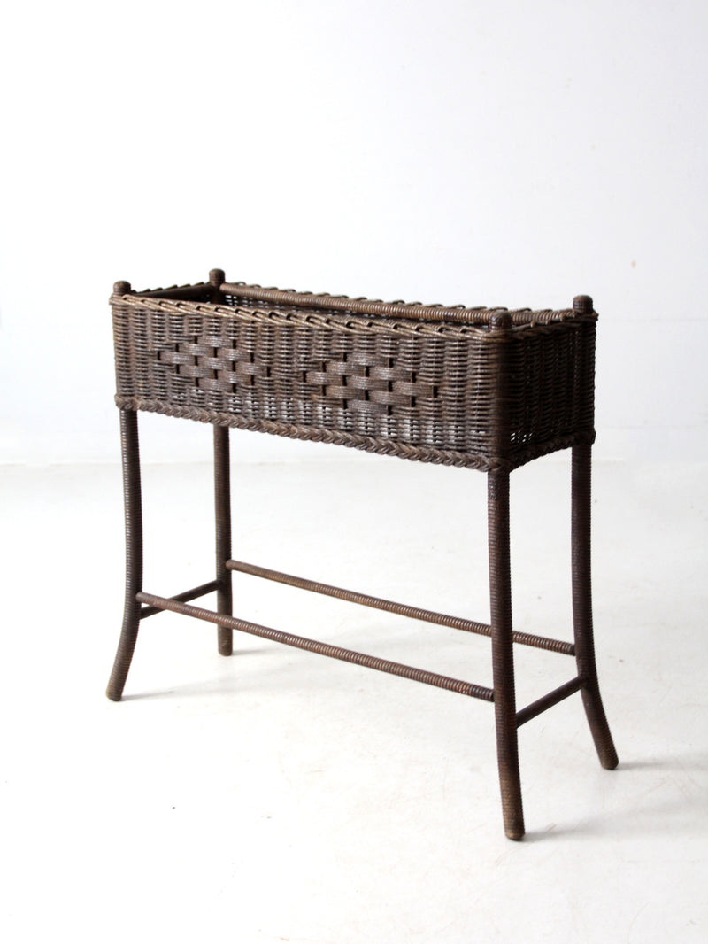 antique woven wicker planter stand