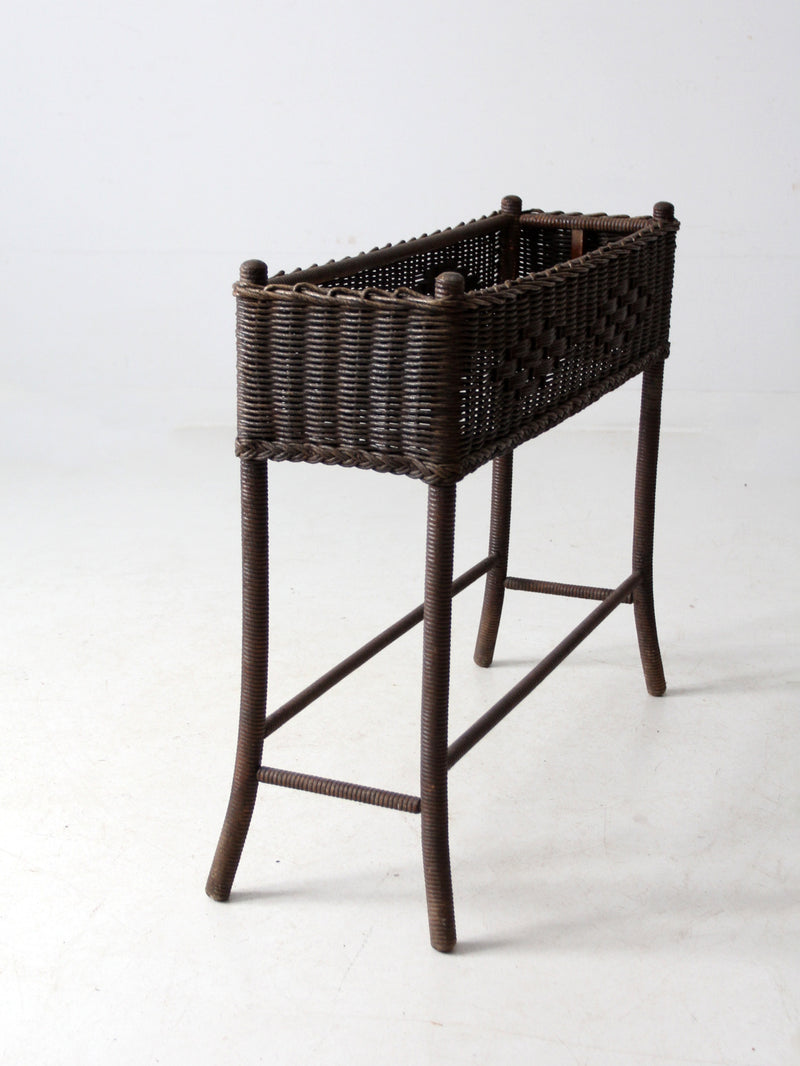 antique woven wicker planter stand