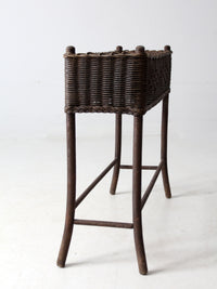 antique woven wicker planter stand