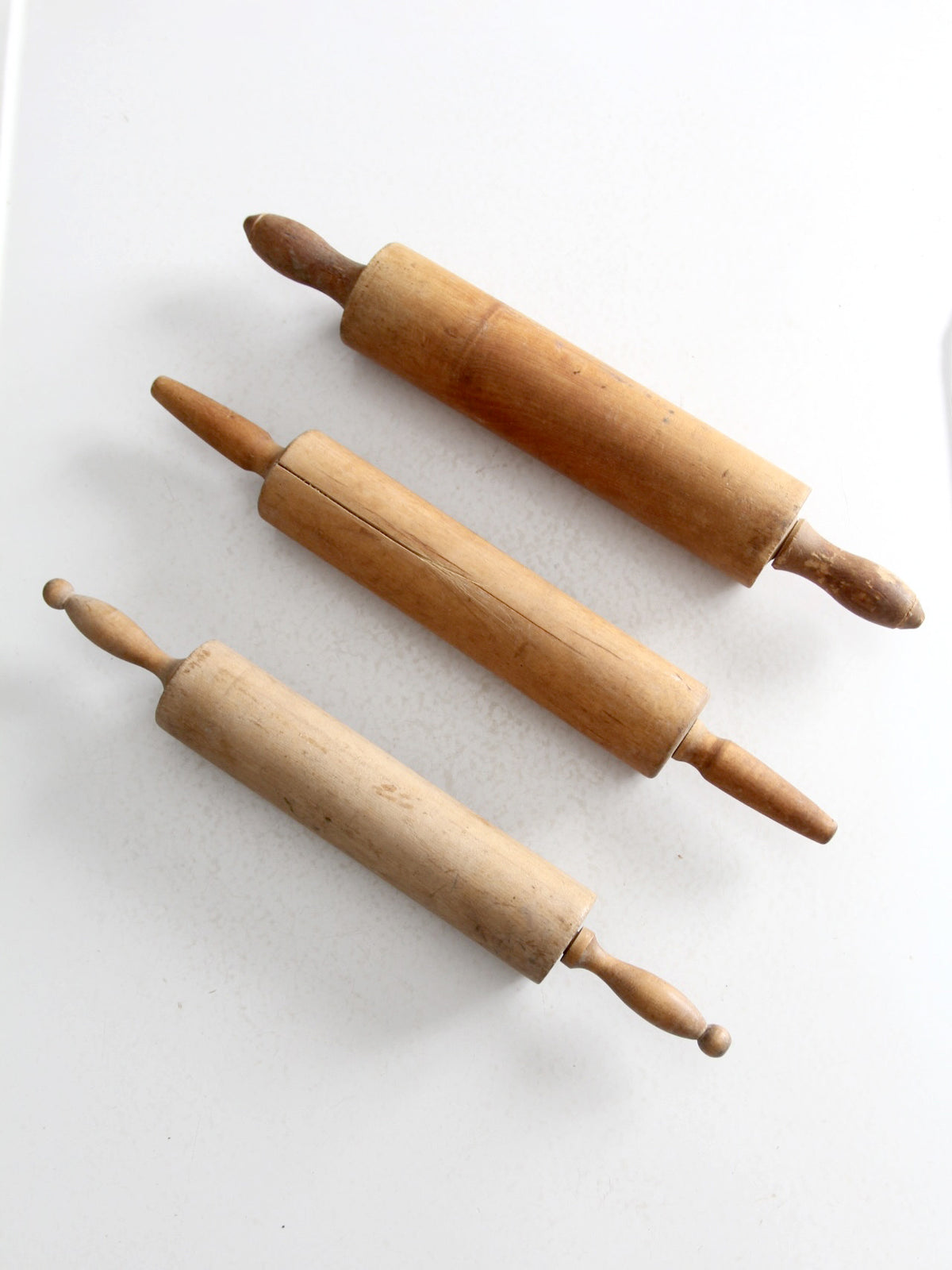 set of antique rolling pins