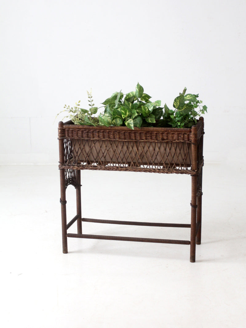 antique wicker planter stand