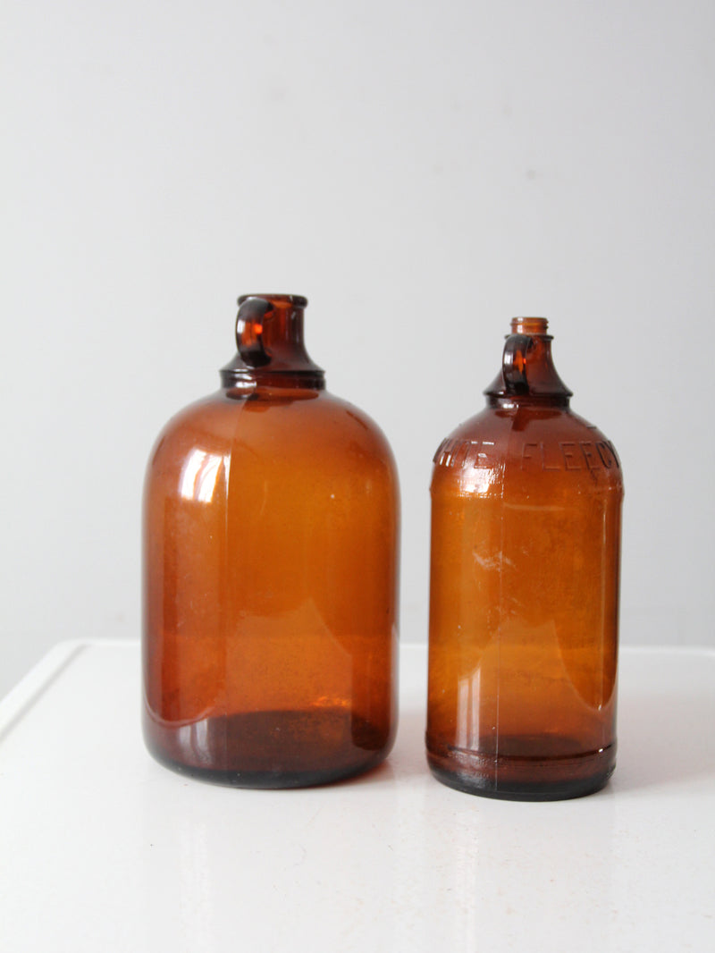 vintage brown glass bottle jugs pair