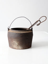 antique smelting pot and ladles