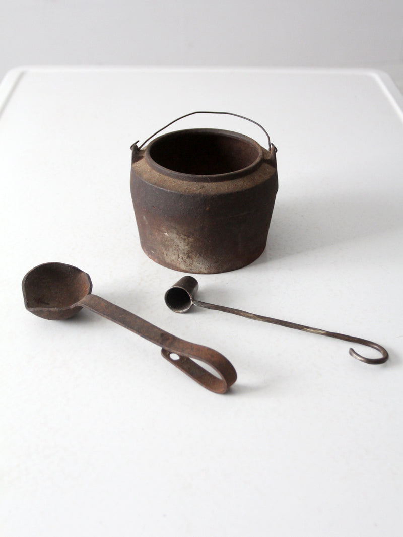 antique smelting pot and ladles