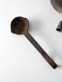 antique smelting pot and ladles