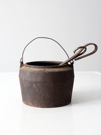 antique smelting pot and ladles