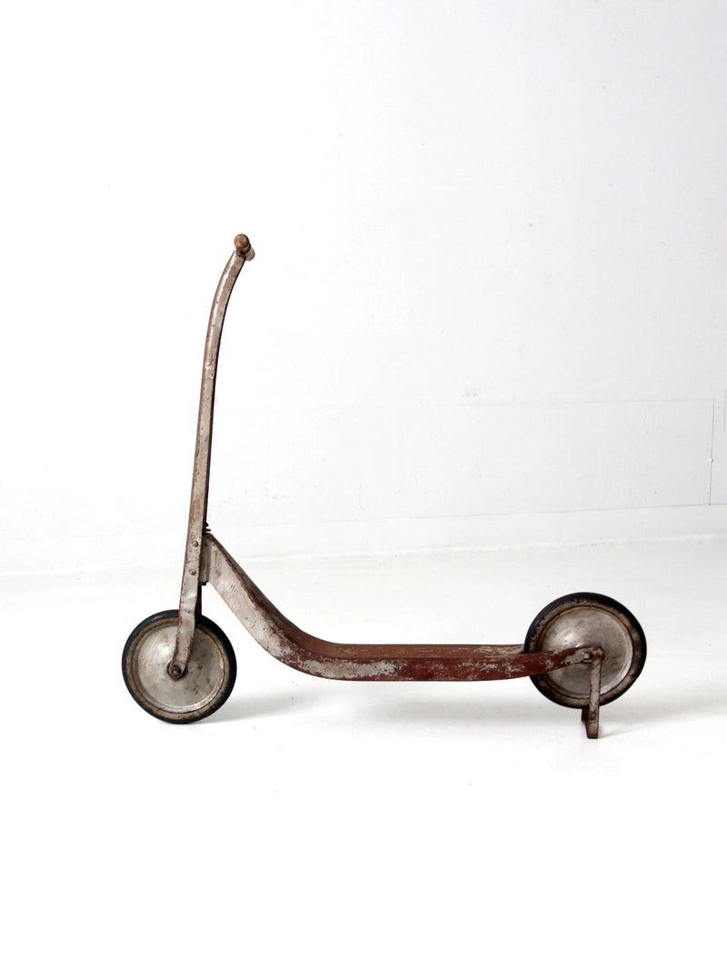 vintage toy scooter circa 1940s