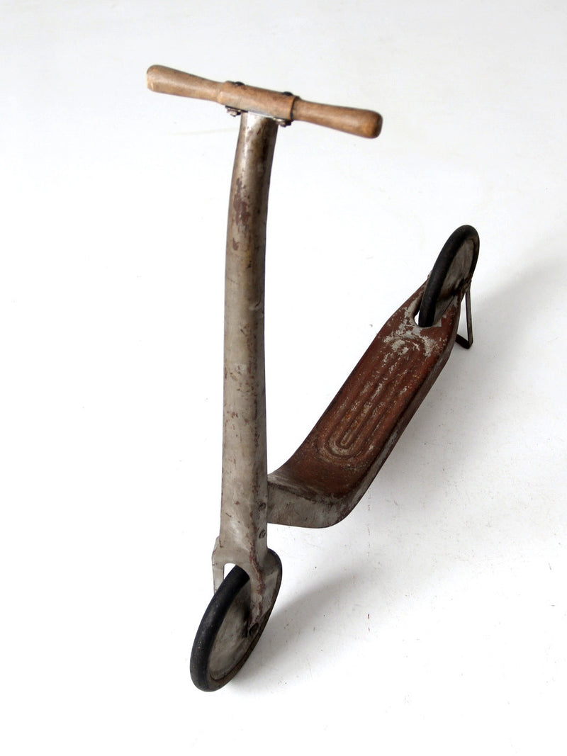 vintage toy scooter circa 1940s