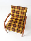 mid century lounge chair with plaid upholstery