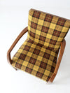 mid century lounge chair with plaid upholstery