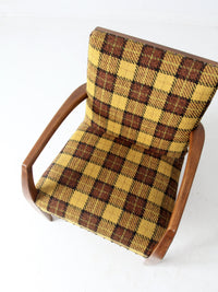 mid century lounge chair with plaid upholstery