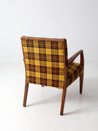 mid century lounge chair with plaid upholstery