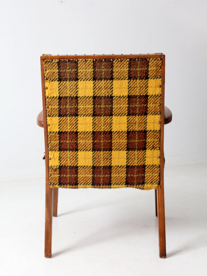 mid century lounge chair with plaid upholstery