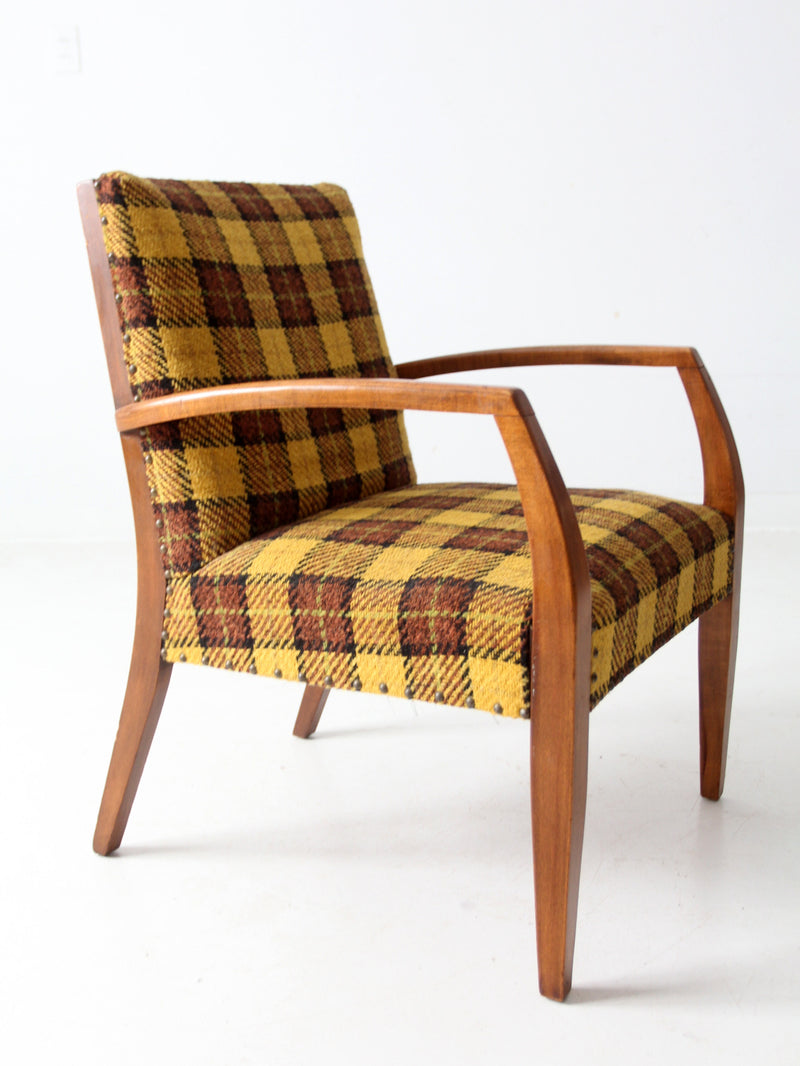 mid century lounge chair with plaid upholstery