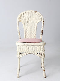 antique wicker chair with gingham cushioned seat