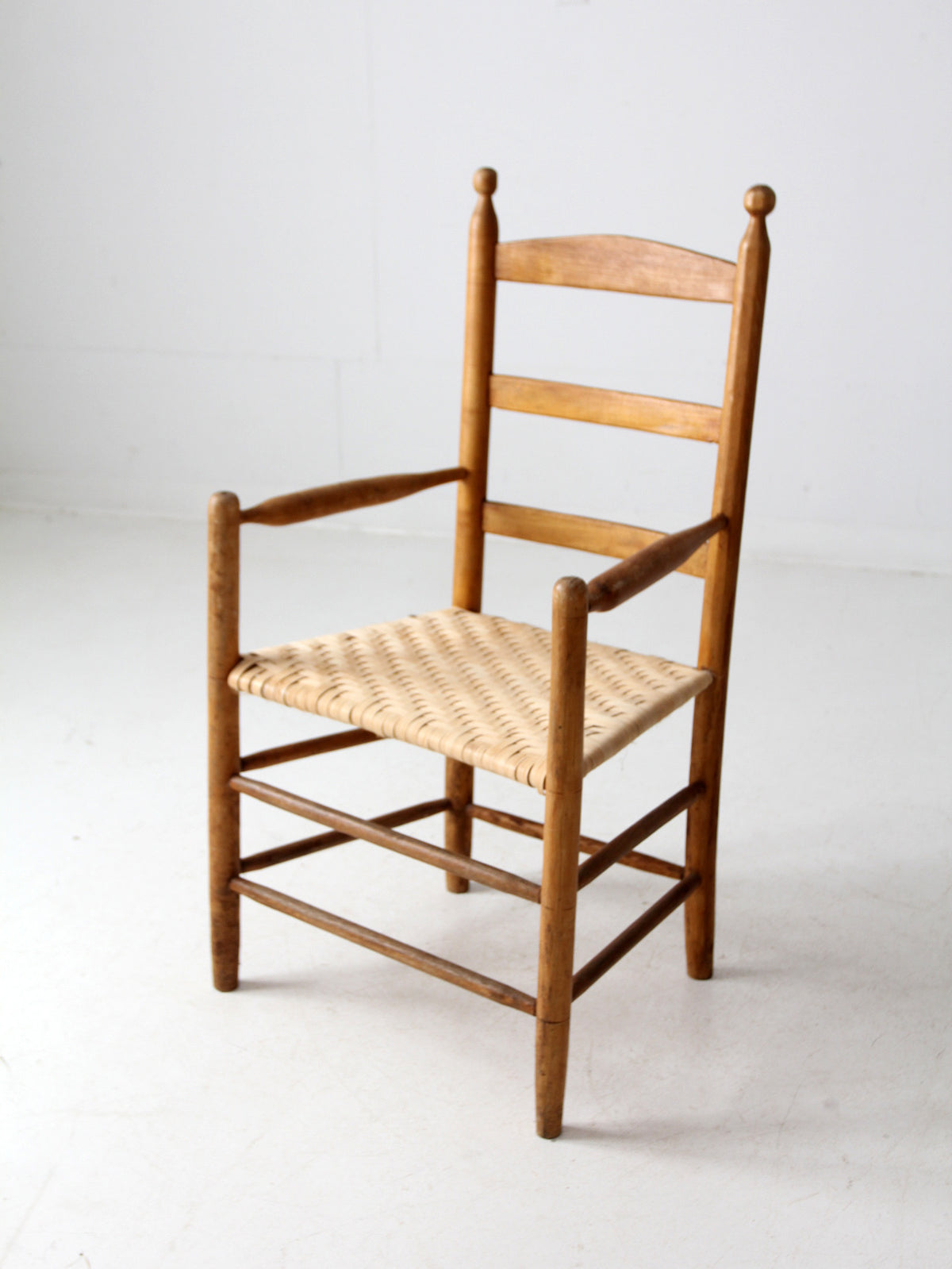 antique woven seat armchair