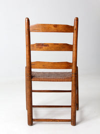 antique ladder back chair with woven seat