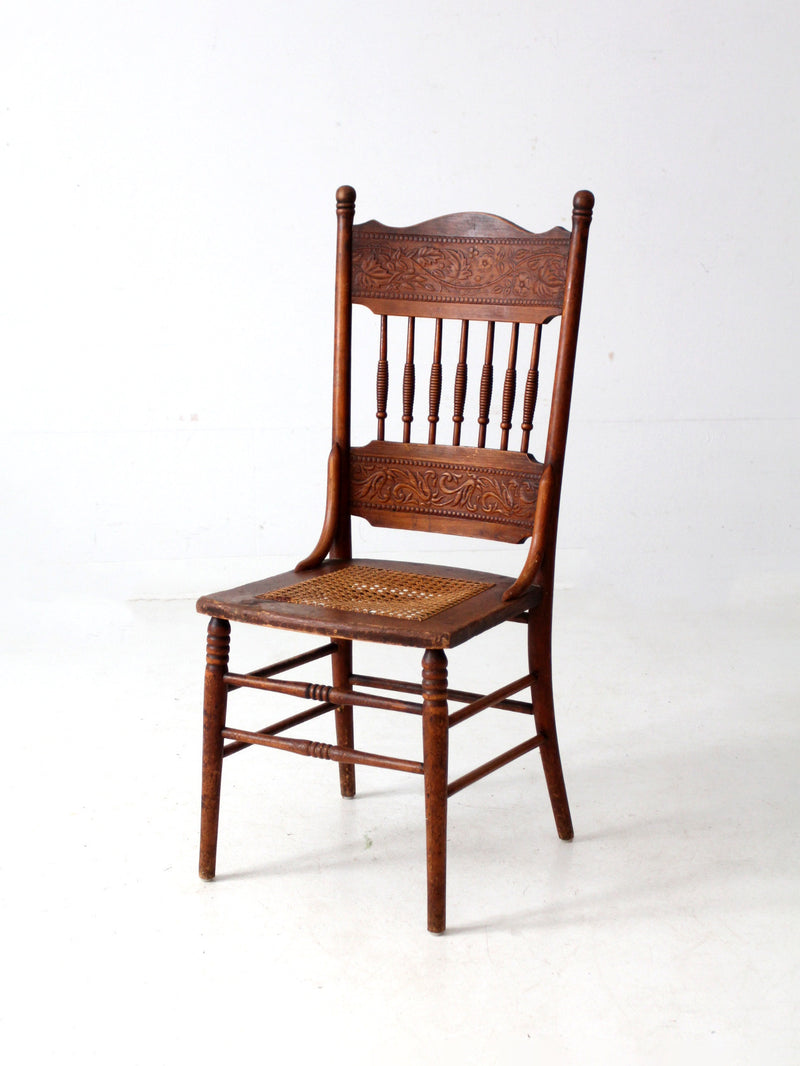 antique pressed back chair with cane seat