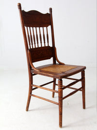 antique pressed back chair with cane seat