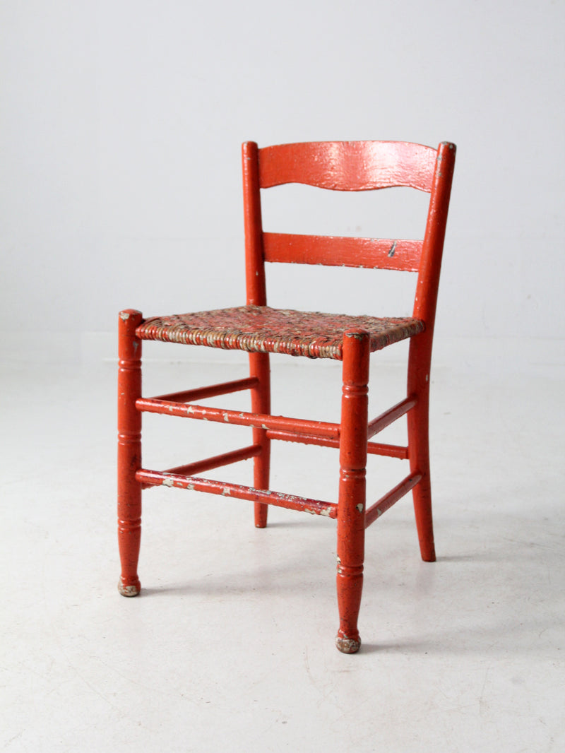 antique rusted painted woven seat chair