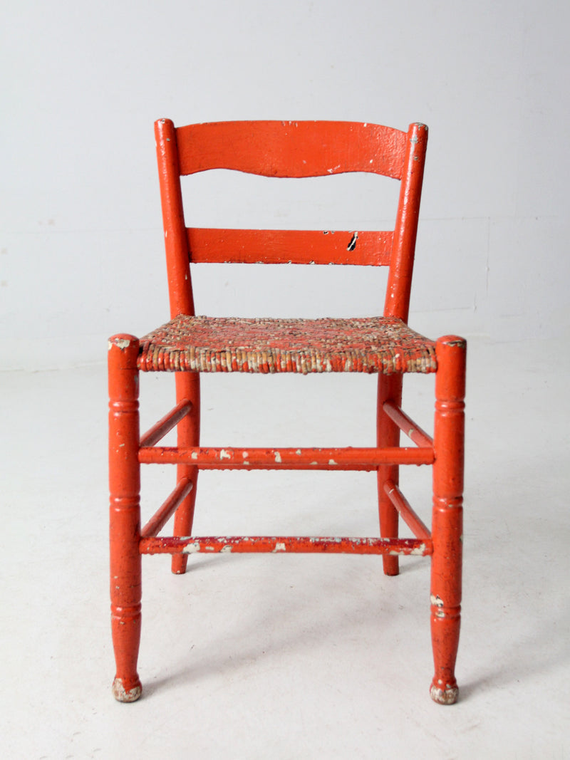 antique rusted painted woven seat chair