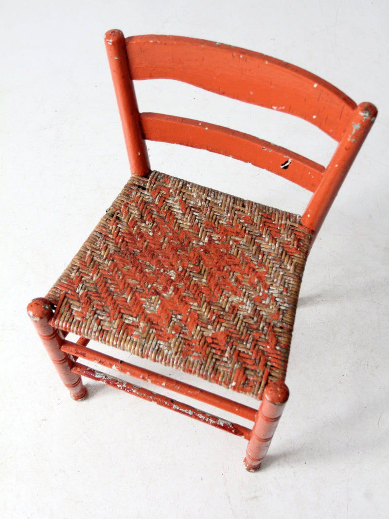 antique rusted painted woven seat chair