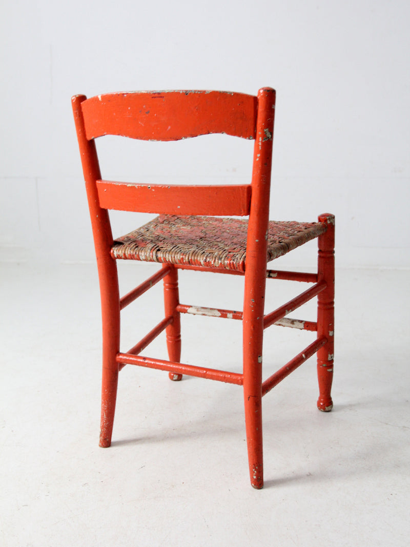 antique rusted painted woven seat chair