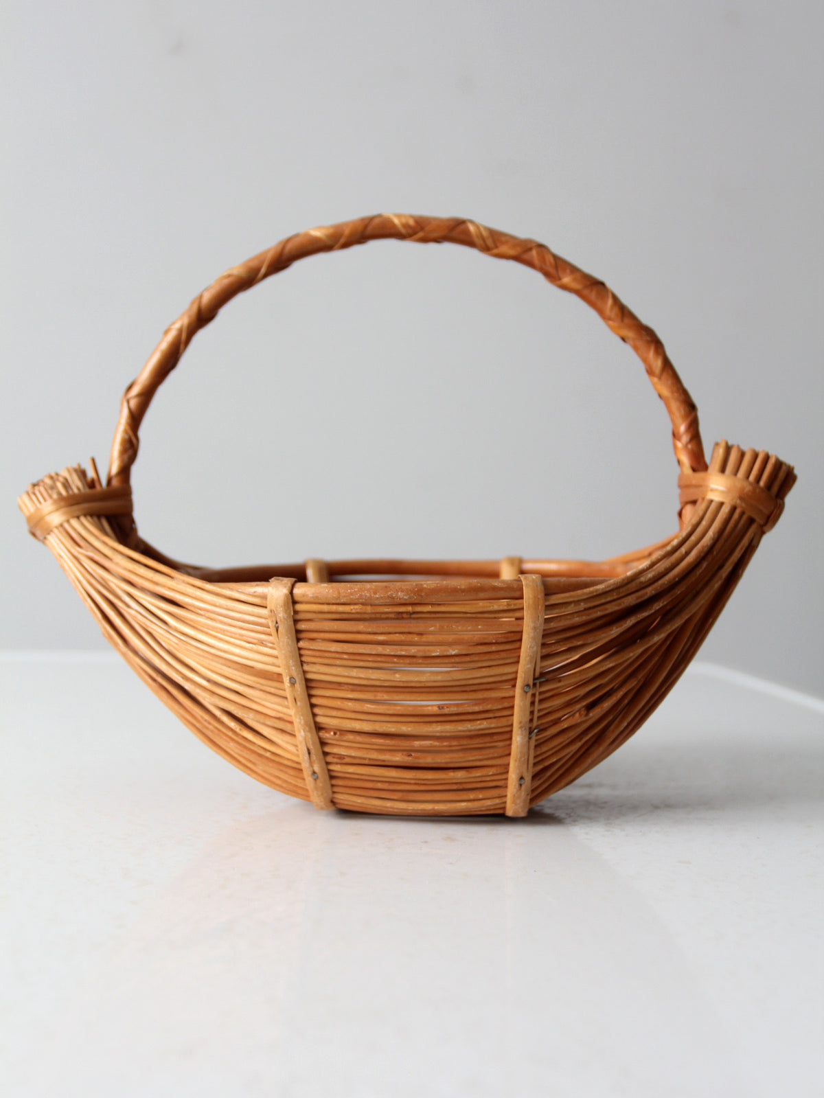 vintage rattan boat shaped basket