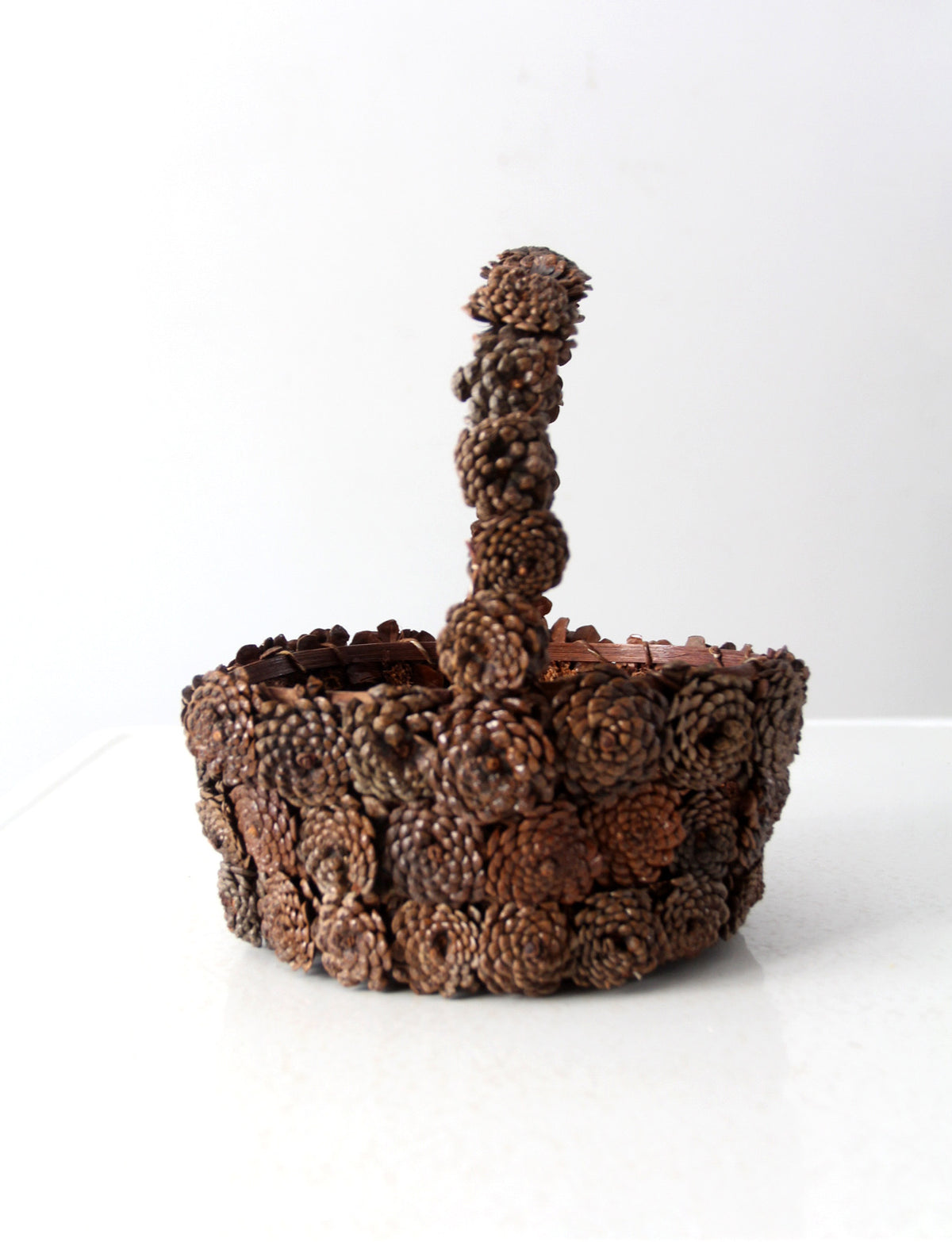 vintage folk art pinecone basket