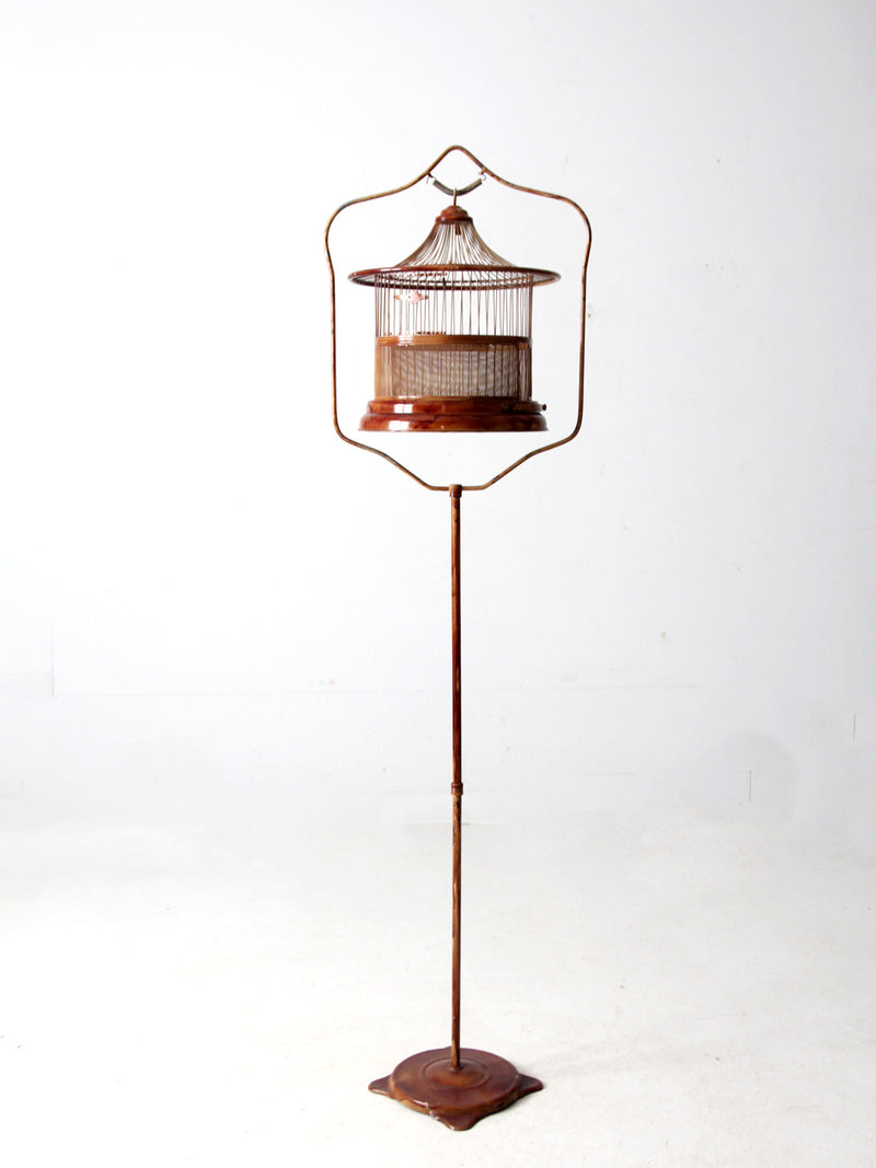 antique lacquered metal birdcage with stand