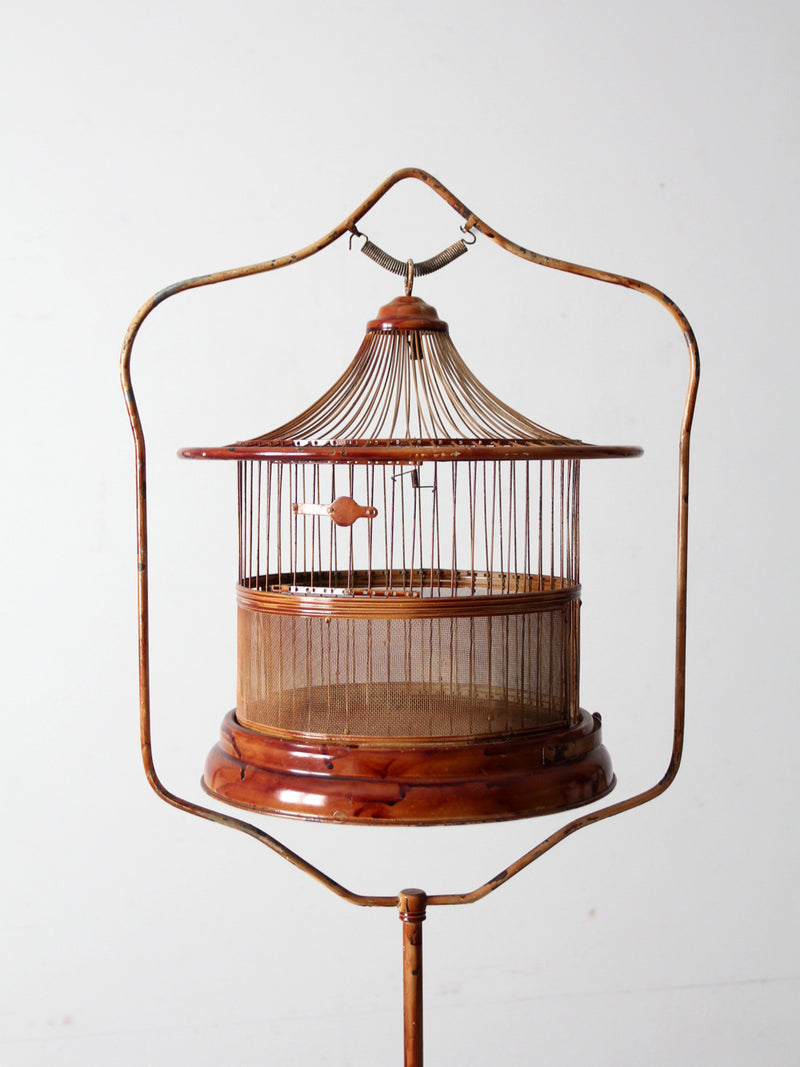 antique lacquered metal birdcage with stand