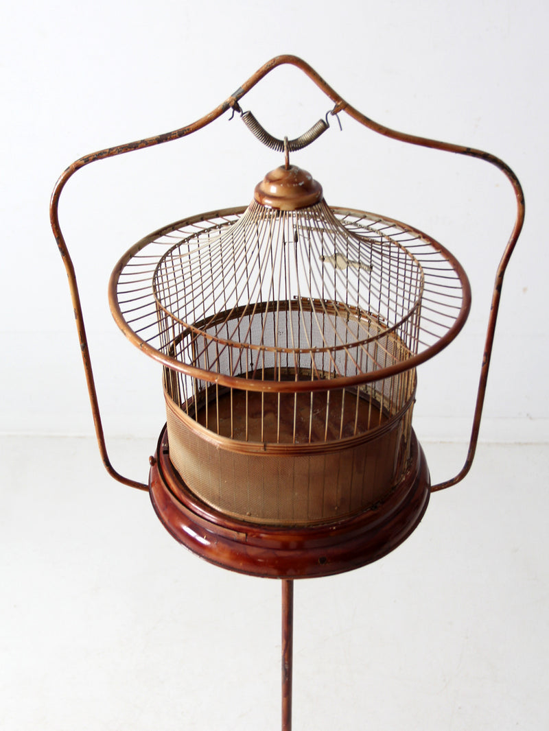 antique lacquered metal birdcage with stand