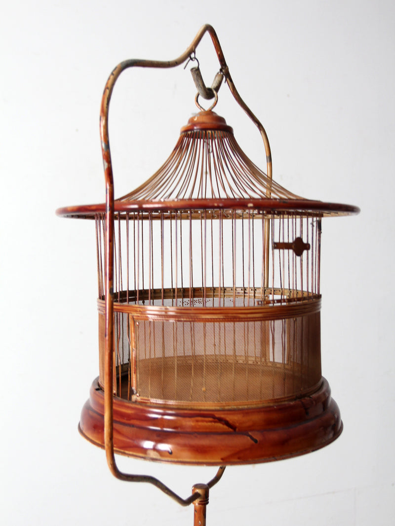 antique lacquered metal birdcage with stand