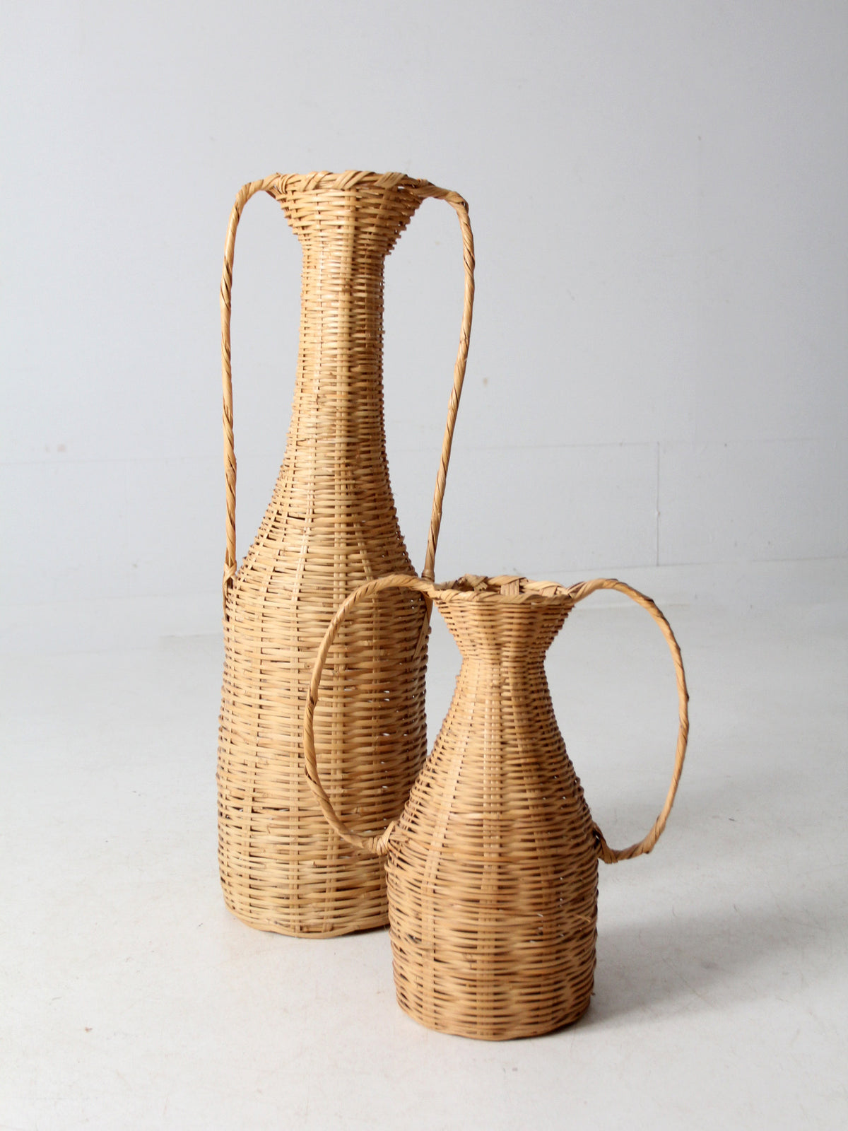 vintage rattan amphora baskets pair