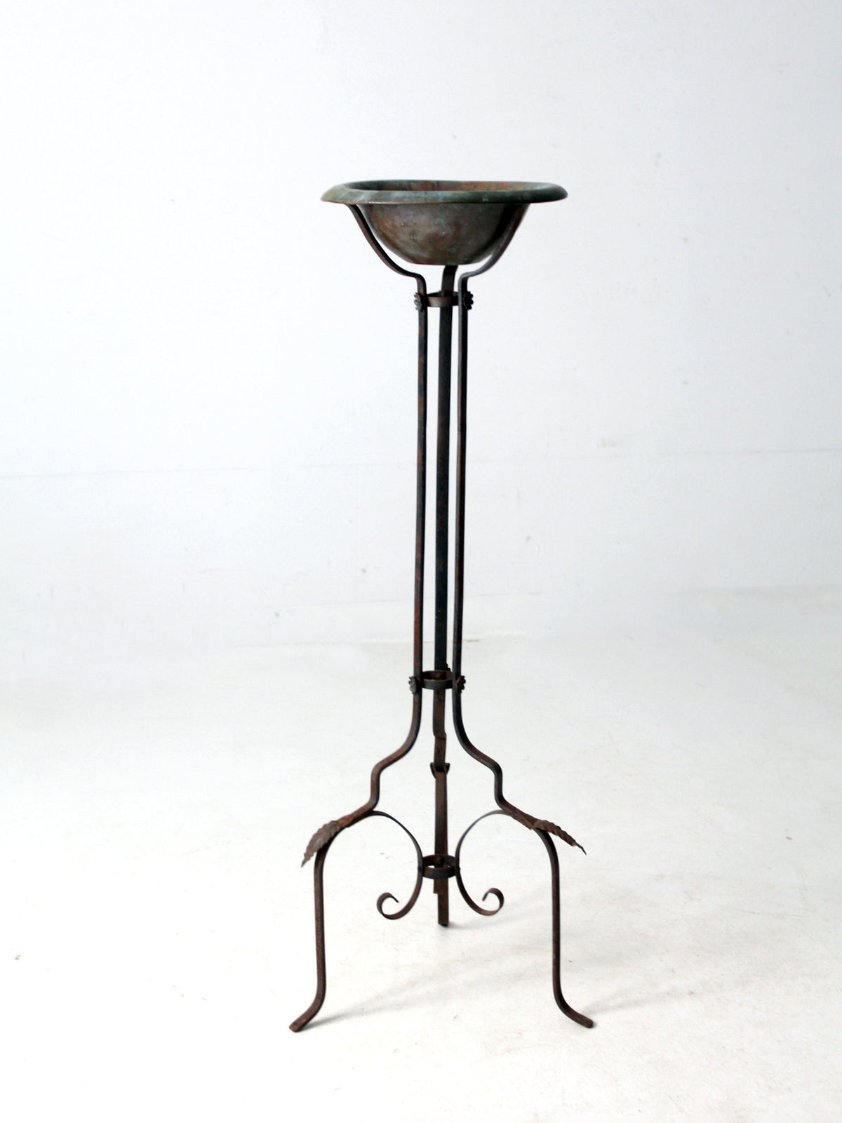 antique wrought iron plantstand with copper bowl