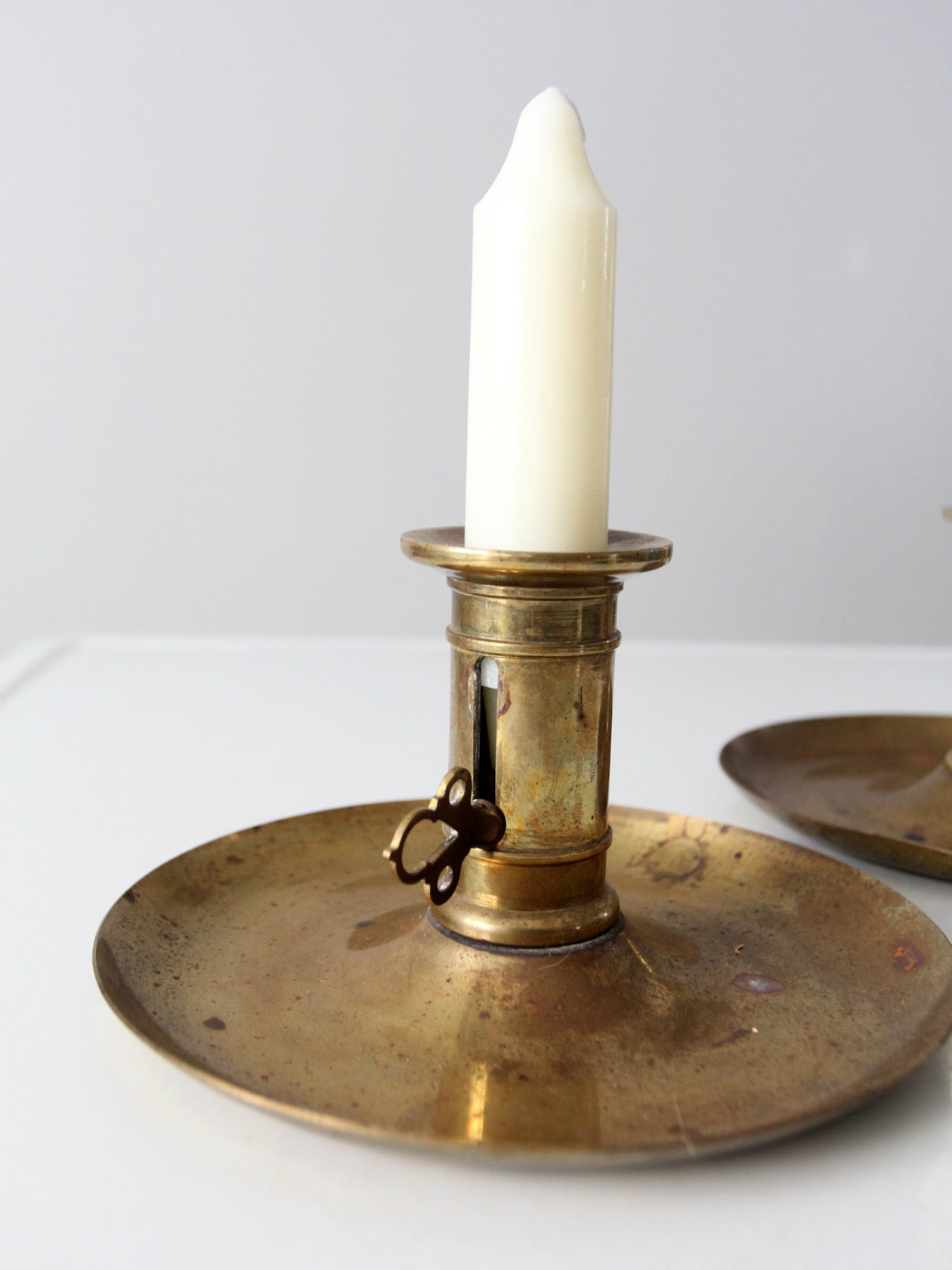 antique brass push-up candle holders pair – 86 Vintage